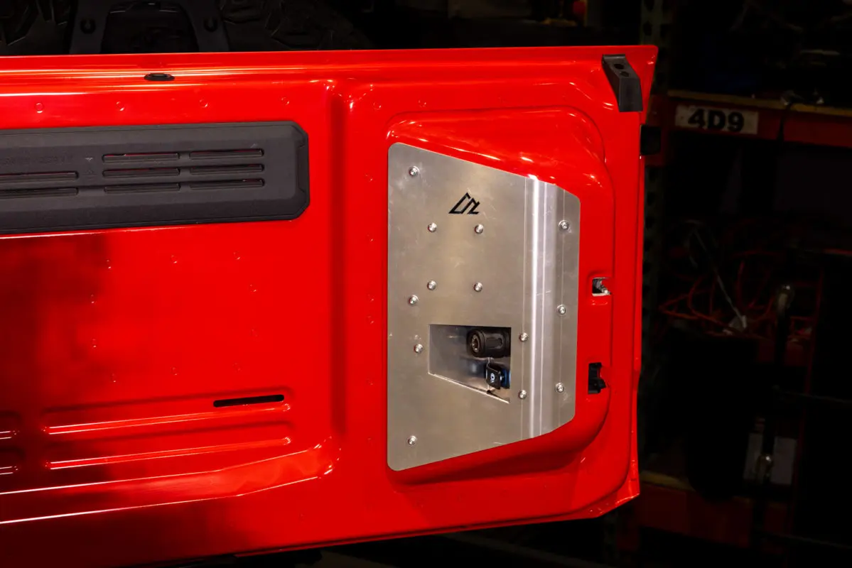 Ford Bronco tailgate compressor mount shown installed