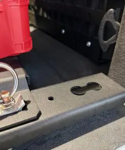 Textured black F-150 BASE rail showing a dogbone L-track cutout, an M8 tapped hole, and a ring connector in an adjacent cutout.