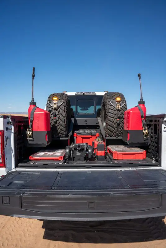 F-150 BASE storage layout viewed from the tailgate at a desert campsite
