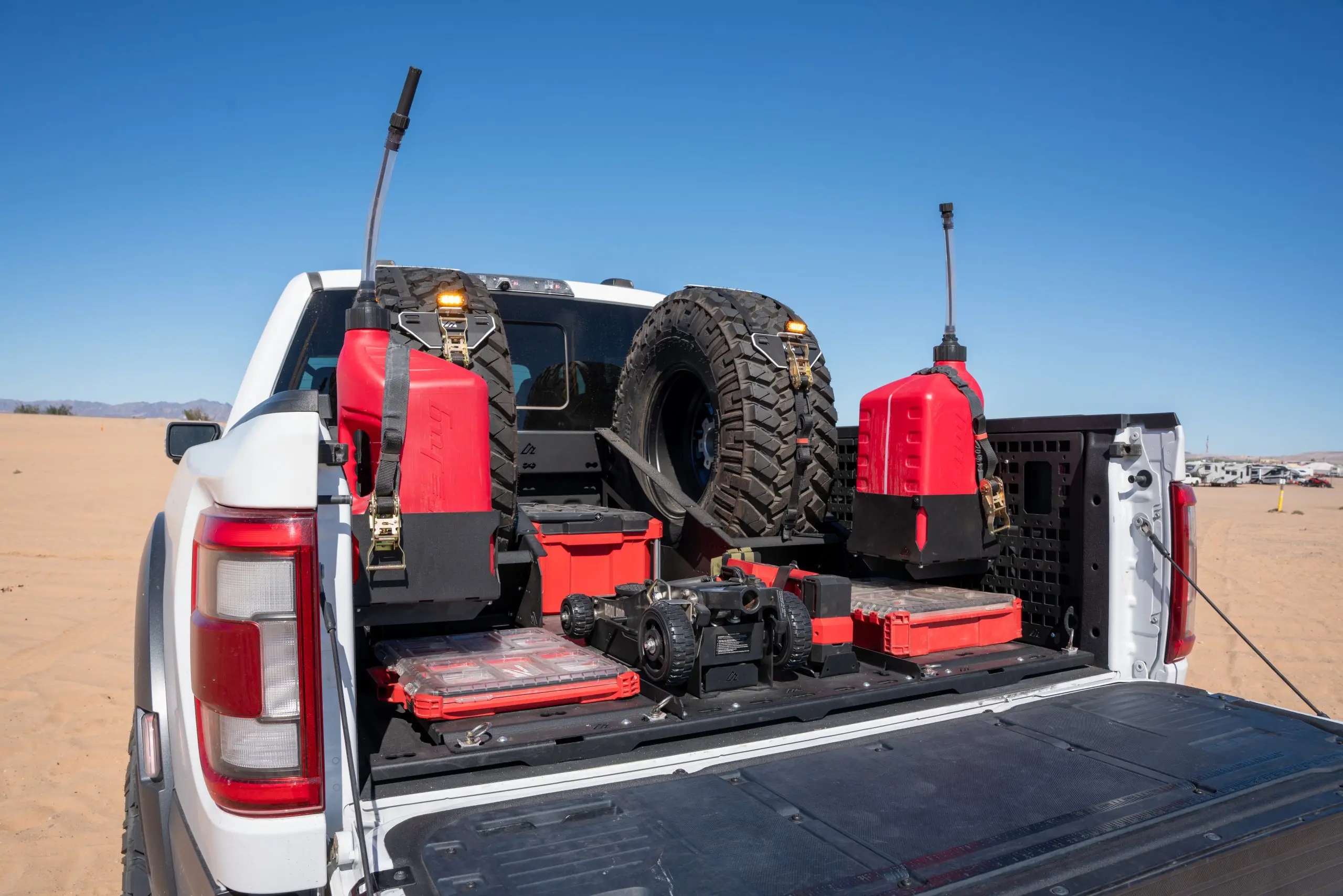 F-150 bed with upright spare tires, tool cases and fuel-container mounts