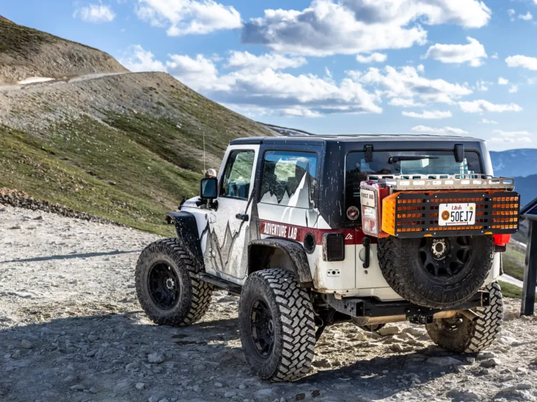 Jeep Wrangler JK 2-Door navigating rocky desert trail with overland accessories installed