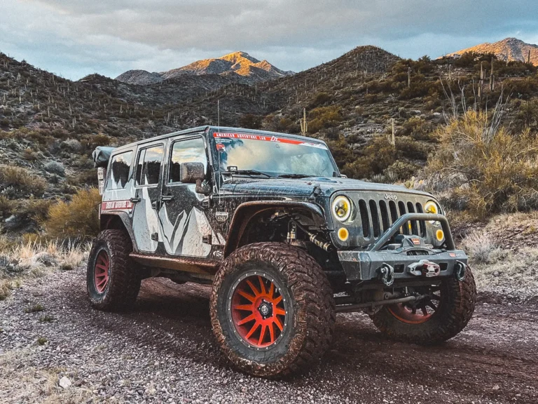 Jeep Wrangler JKU 4-Door outfitted for overlanding with roof rack and gear system